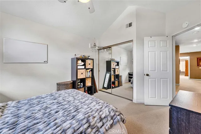 a bedroom with a bed and a closet