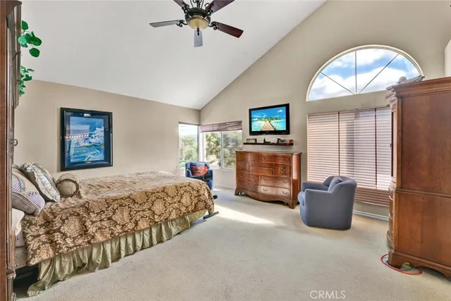 a bedroom with bed and a couch