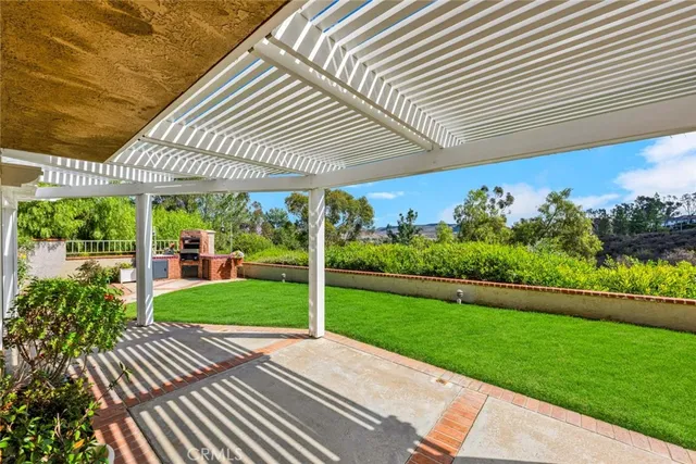a view of a patio with a yard