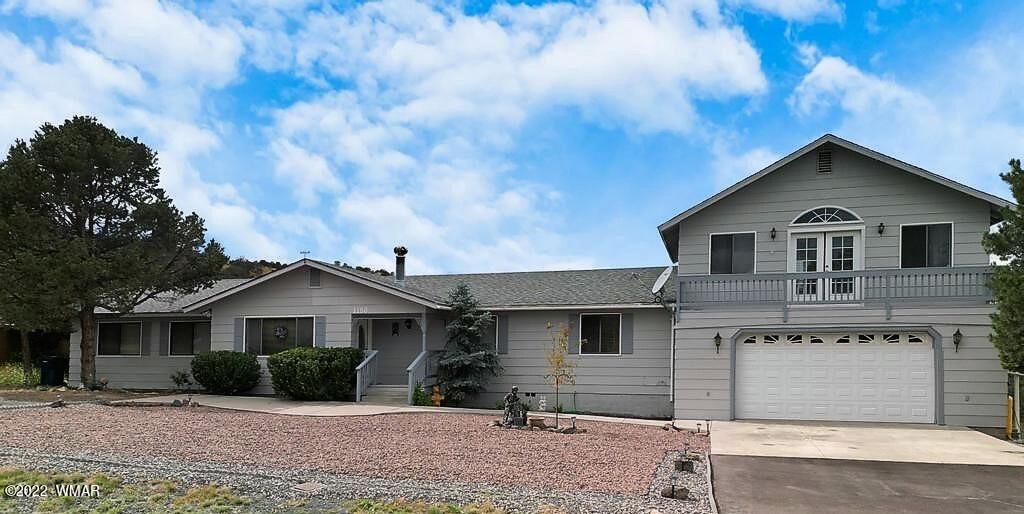 1180 Timberline Drive Eagar, AZ 85925 - Photo 1 of 48 a front view of a house with a yard