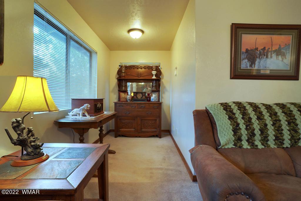 1180 Timberline Drive Eagar, AZ 85925 - Photo 11 of 48 a living room with a couch and a table
