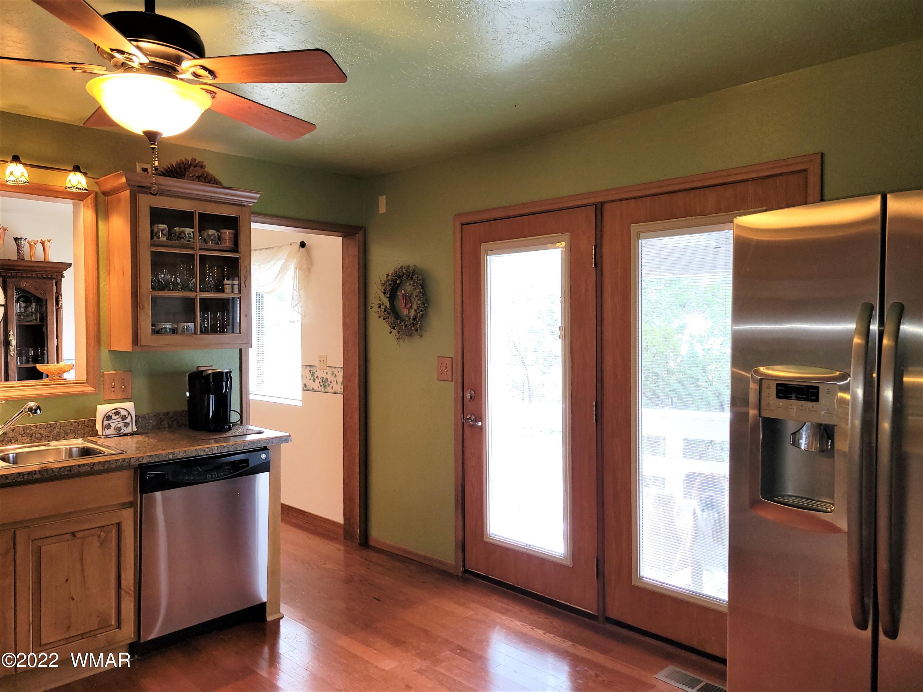 1180 Timberline Drive Eagar, AZ 85925 - Photo 18 of 48 a kitchen with stainless steel appliances granite countertop a refrigerator a sink and dishwasher