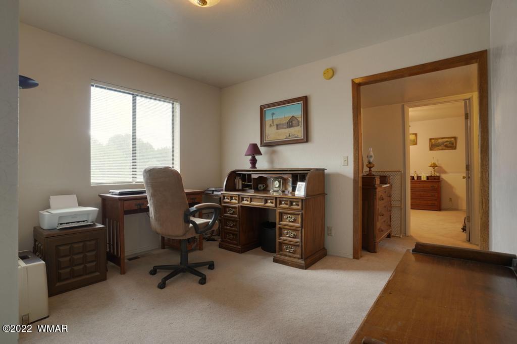 1180 Timberline Drive Eagar, AZ 85925 - Photo 23 of 48 a view of a workspace with furniture and a window