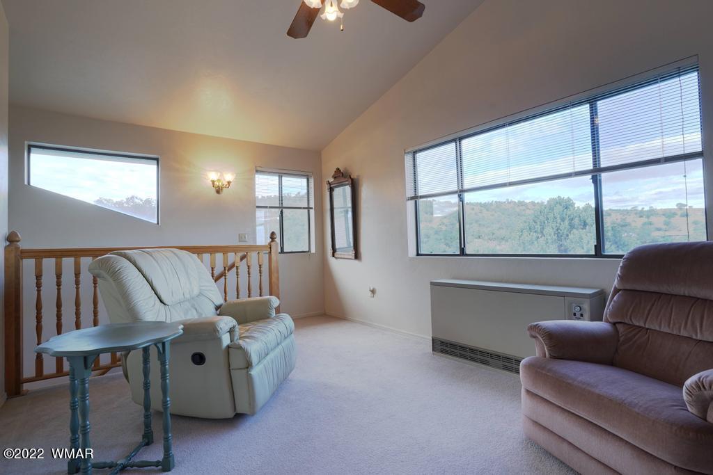1180 Timberline Drive Eagar, AZ 85925 - Photo 25 of 48 a living room with furniture and a large window
