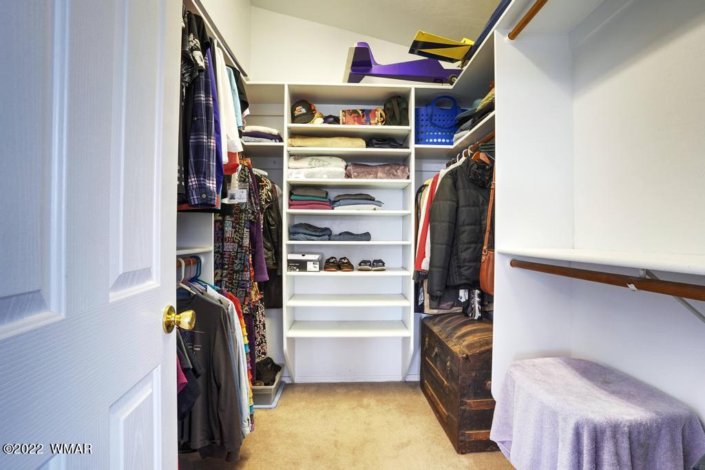 1180 Timberline Drive Eagar, AZ 85925 - Photo 28 of 48 a view of walk in closet with clothes and shoes