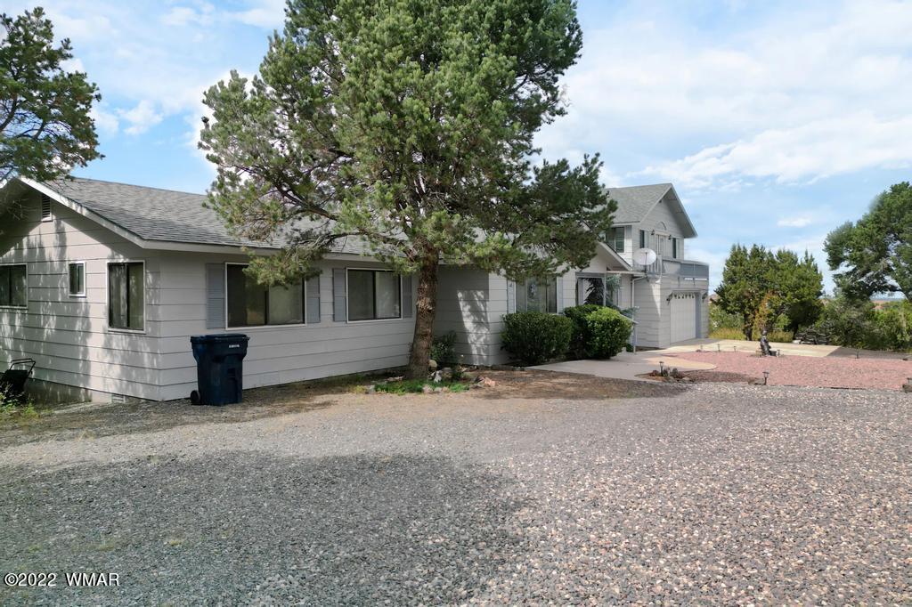 1180 Timberline Drive Eagar, AZ 85925 - Photo 37 of 48 a view of a house with a yard and garage