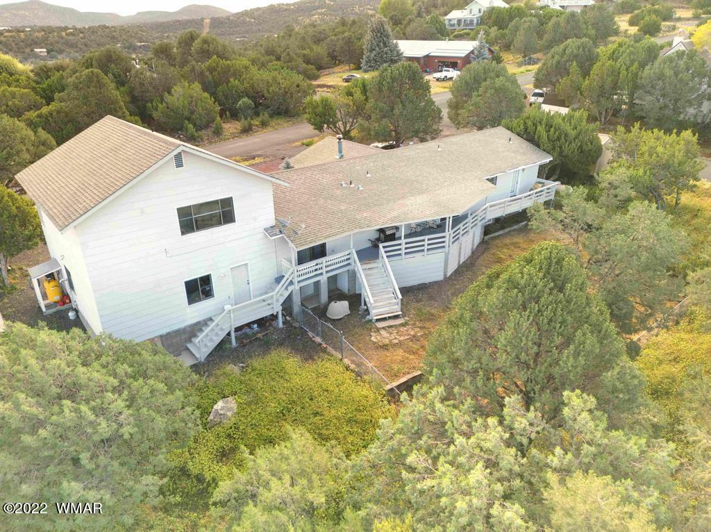 1180 Timberline Drive Eagar, AZ 85925 - Photo 42 of 48 a view of a house with a yard