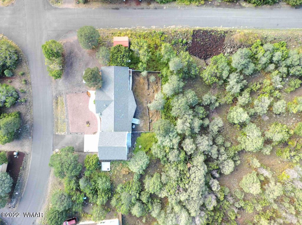 1180 Timberline Drive Eagar, AZ 85925 - Photo 44 of 48 an aerial view of a house with a yard and garden