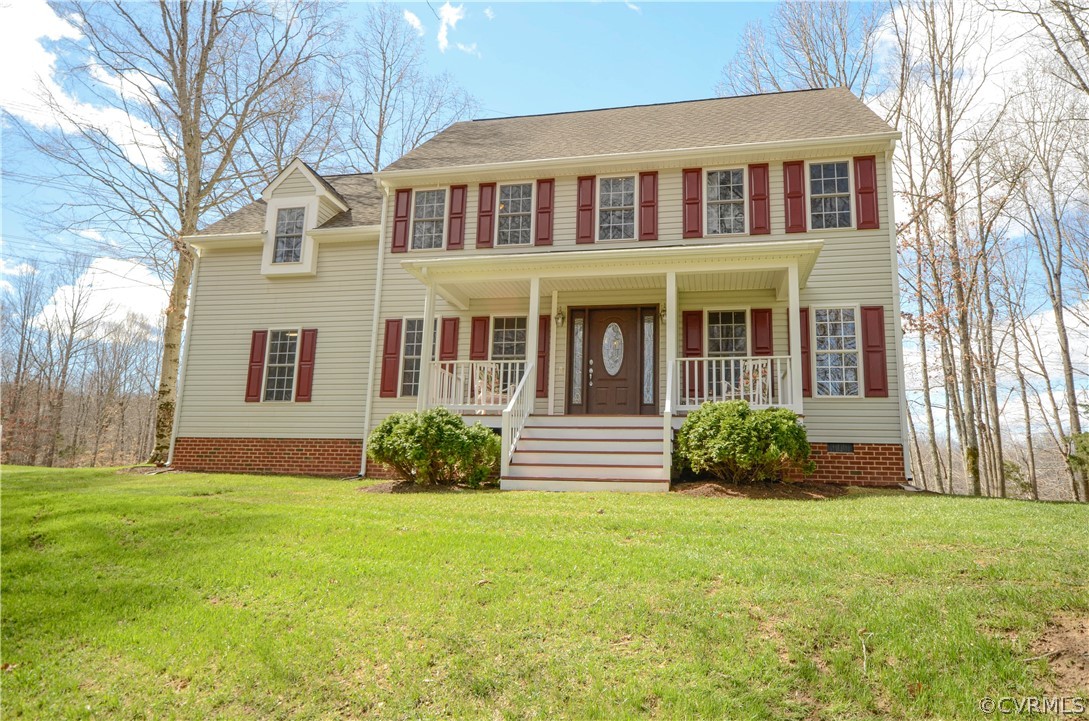 4400 Spring Rock Road Gum Spring, VA 23065 - Photo 1 of 35 a front view of a house with garden