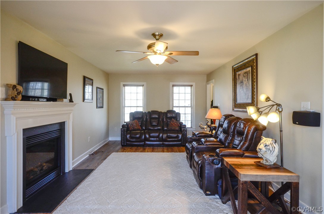 4400 Spring Rock Road Gum Spring, VA 23065 - Photo 14 of 35 a living room with furniture a fireplace and a flat screen tv