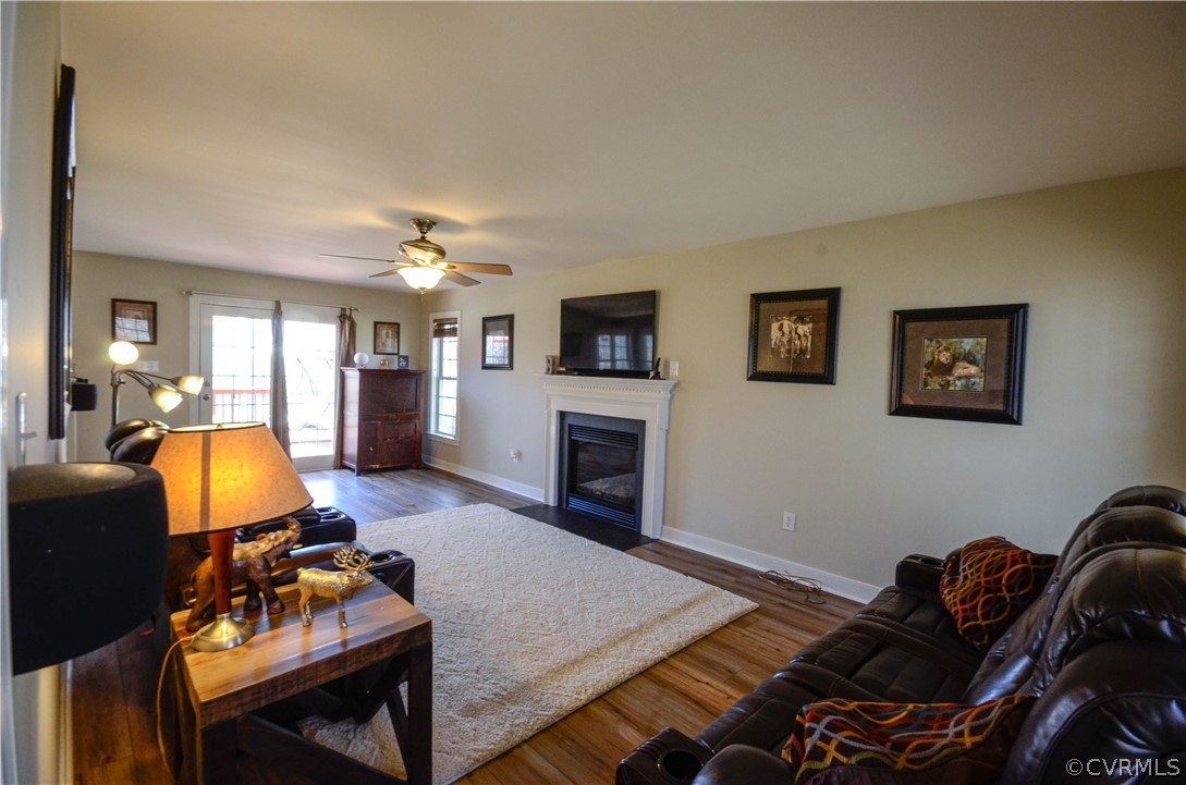 4400 Spring Rock Road Gum Spring, VA 23065 - Photo 15 of 35 a living room with furniture and a fireplace