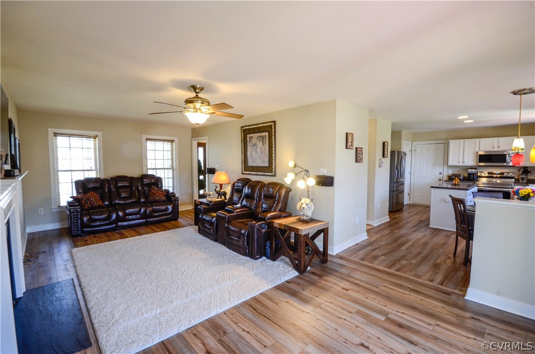 4400 Spring Rock Road Gum Spring, VA 23065 - Photo 16 of 35 a living room with furniture and a chandelier