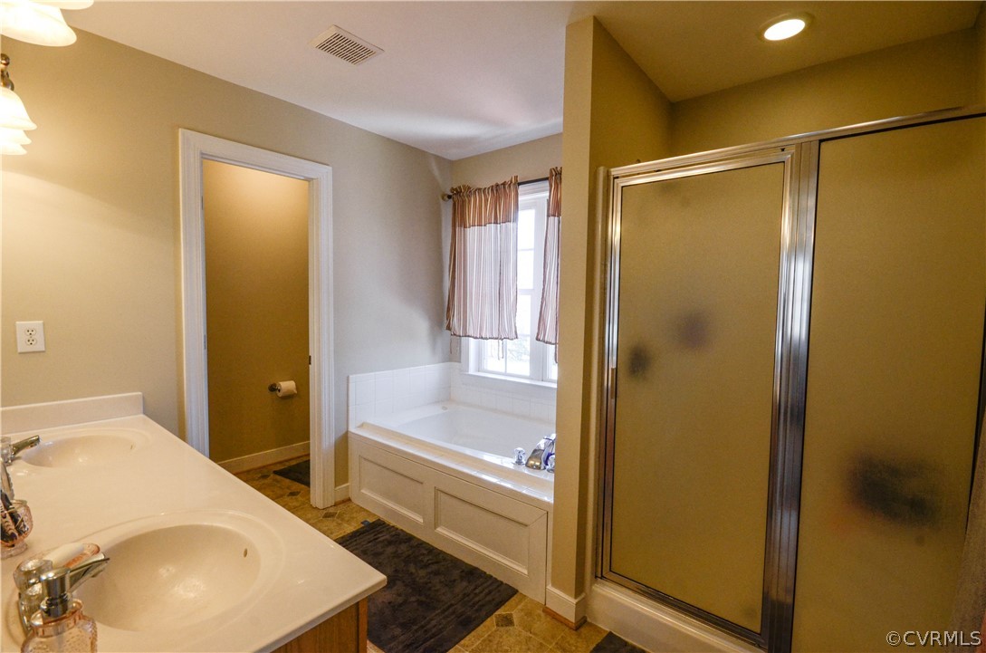 4400 Spring Rock Road Gum Spring, VA 23065 - Photo 21 of 35 a bathroom with a tub and shower