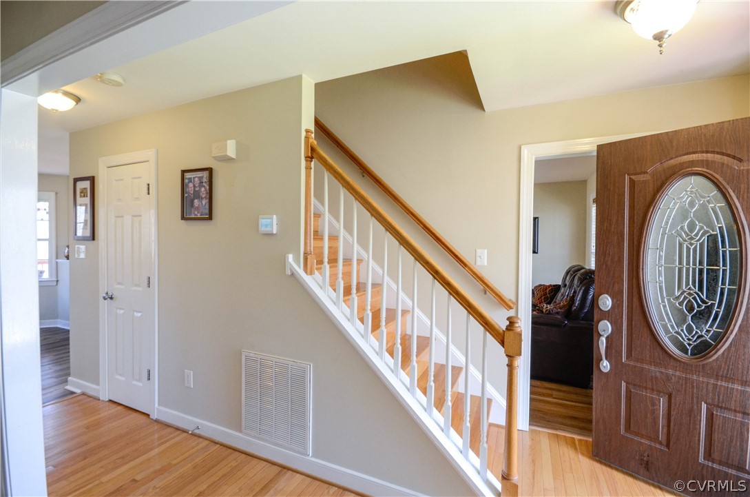 4400 Spring Rock Road Gum Spring, VA 23065 - Photo 8 of 35 a view of a hallway with wooden floor and staircase