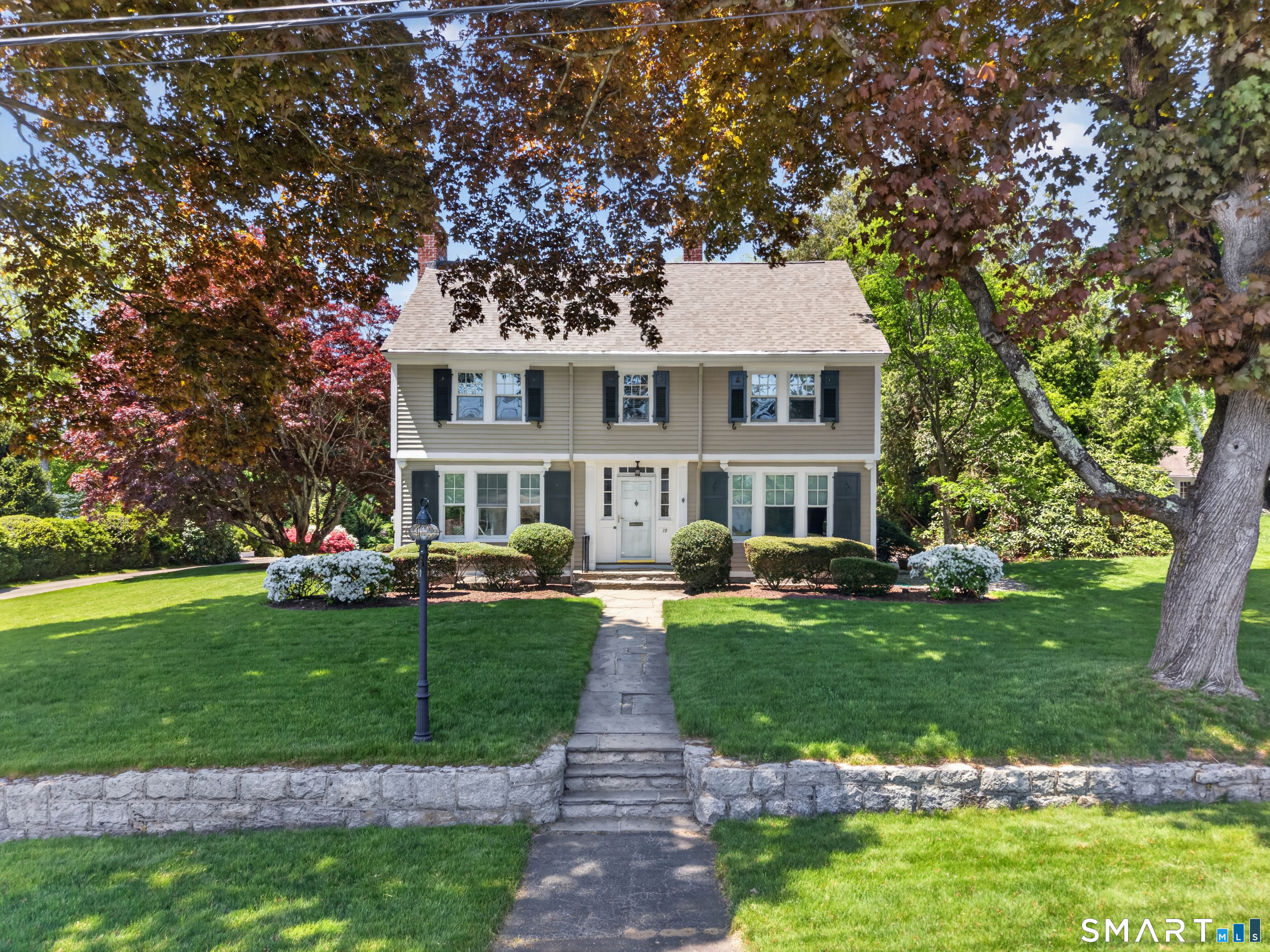 10 Prospect Street Groton, CT 06355 - Photo 23 of 40 a front view of a house with a garden and trees