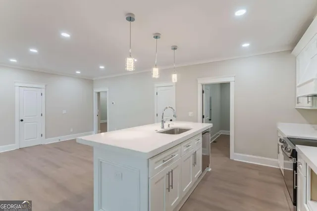 wooden floor in an empty room with a ceiling fan