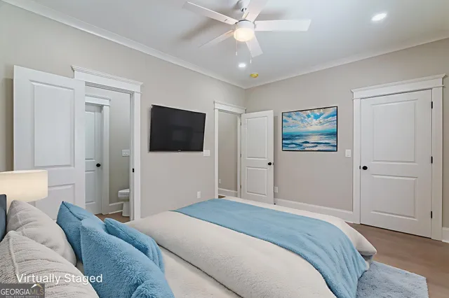 a view of an empty room with a ceiling fan