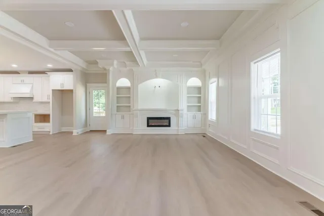 a view of kitchen with sink a refrigerator and a stove