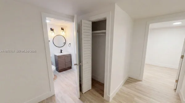 a en suite bathroom with a toilet a sink and mirror