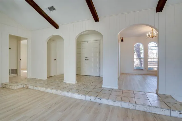 wooden floor with white walls