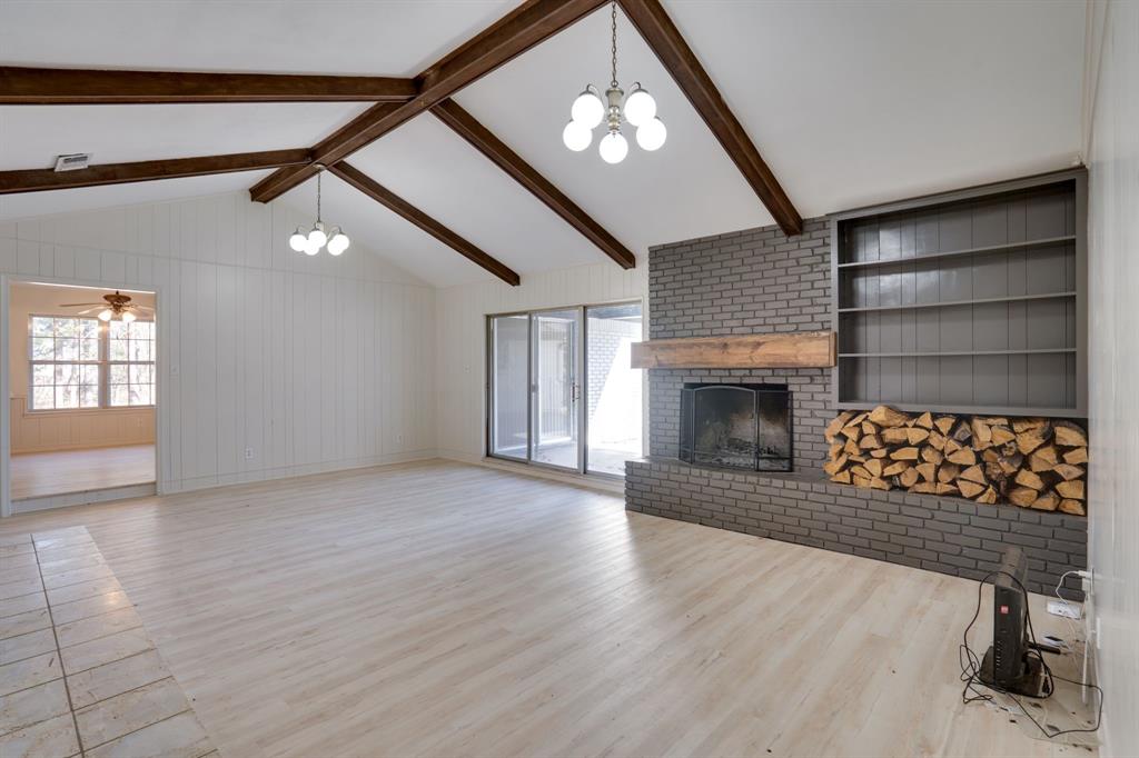 890 Copper Canyon Road Copper Canyon, TX 76226 - Photo 12 of 37 an empty room with windows and fireplace