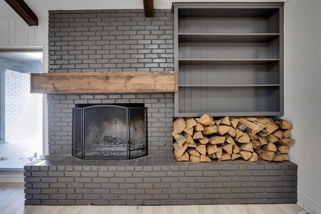 890 Copper Canyon Road Copper Canyon, TX 76226 - Photo 13 of 37 a room with a fireplace