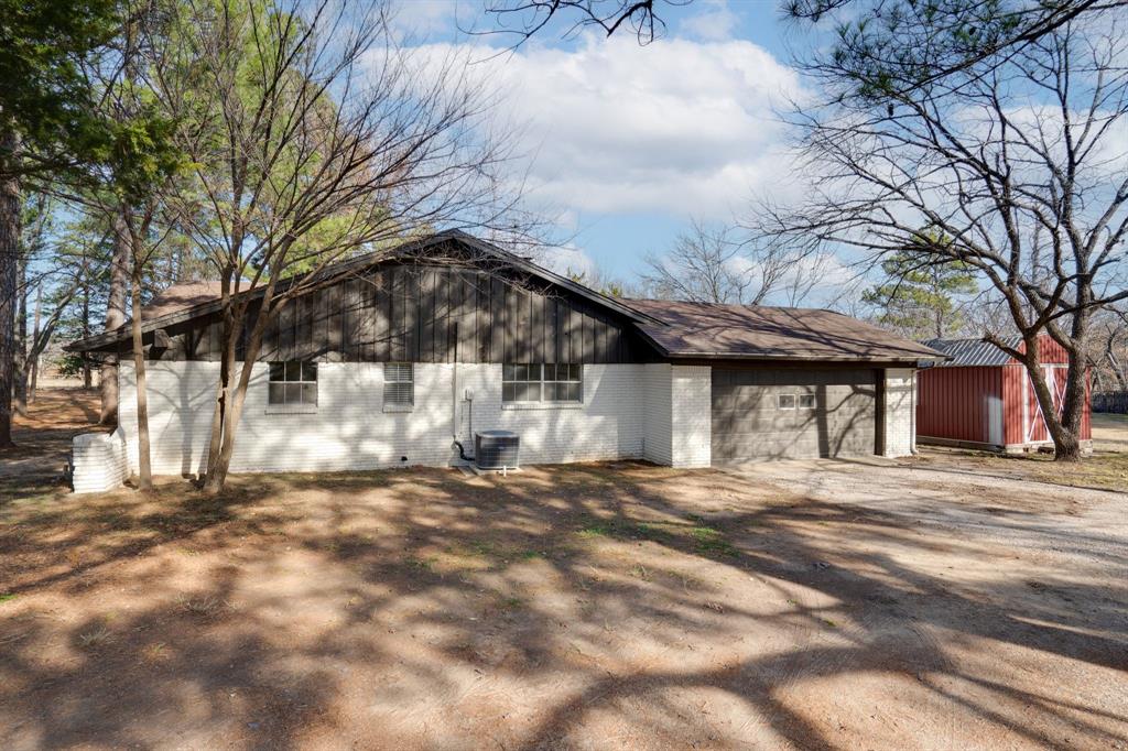890 Copper Canyon Road Copper Canyon, TX 76226 - Photo 2 of 37 a view of a house with a yard