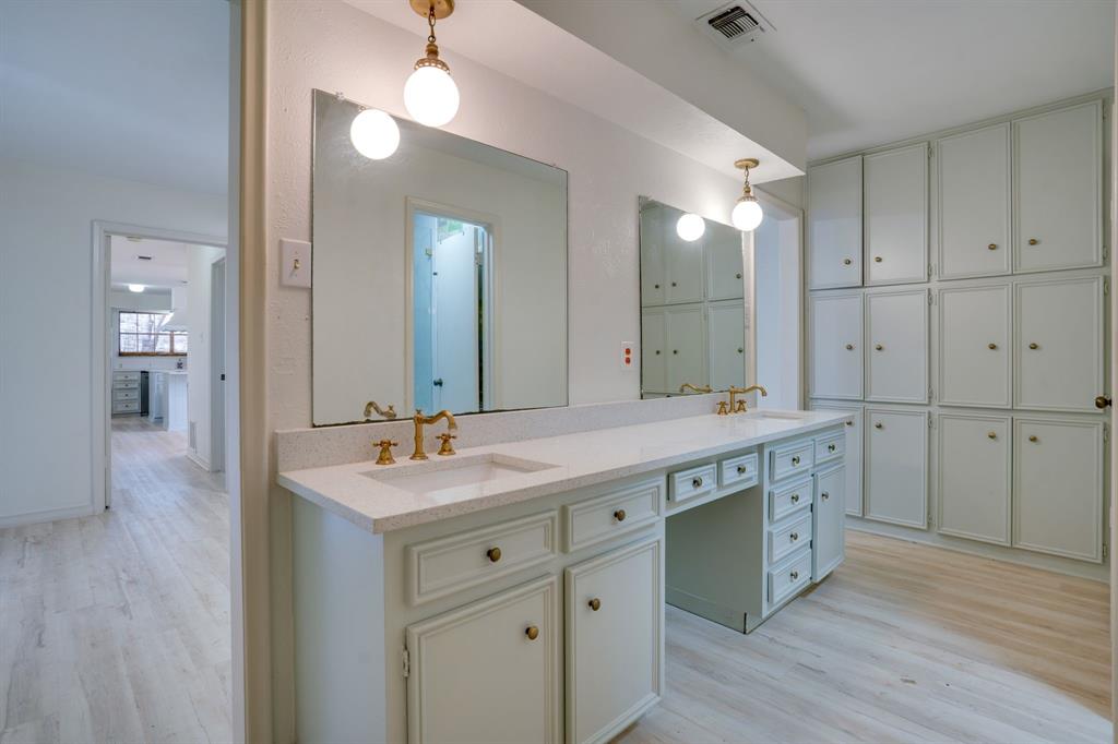890 Copper Canyon Road Copper Canyon, TX 76226 - Photo 23 of 37 a spacious bathroom with a granite countertop sink a mirror and a shower