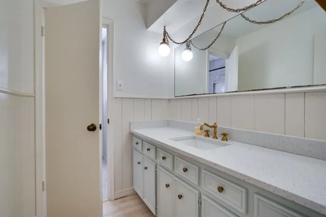 a kitchen with a sink and cabinets
