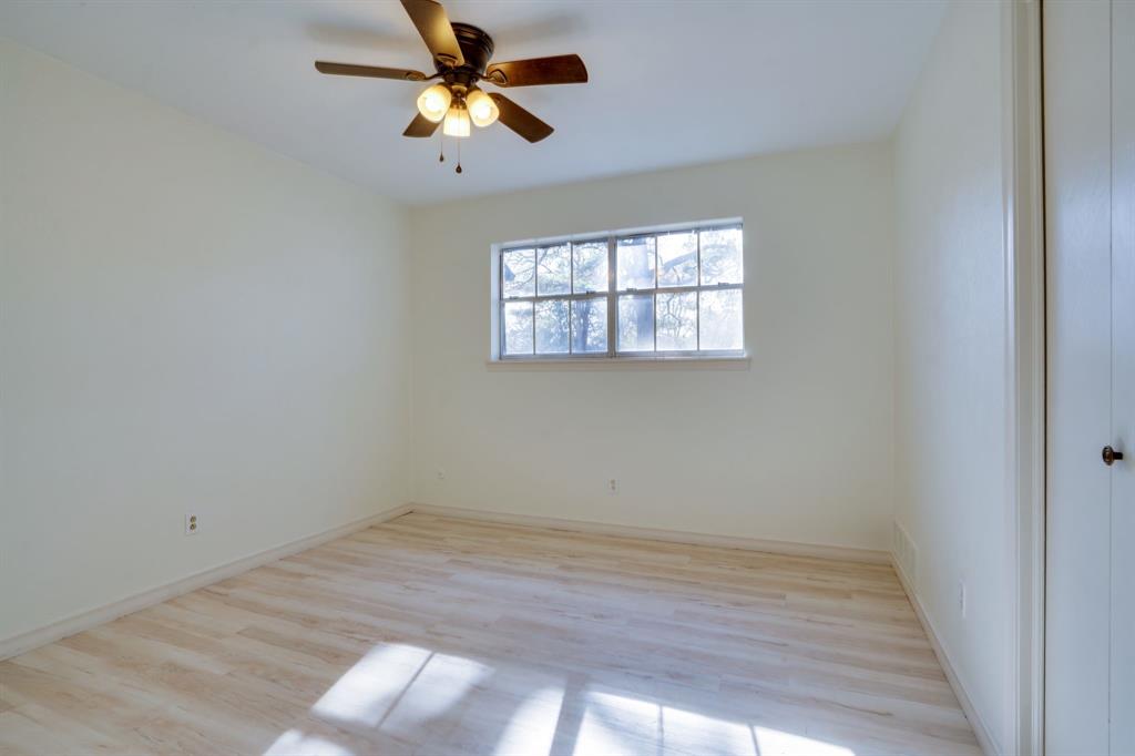 890 Copper Canyon Road Copper Canyon, TX 76226 - Photo 31 of 37 an empty room with a window and a fan