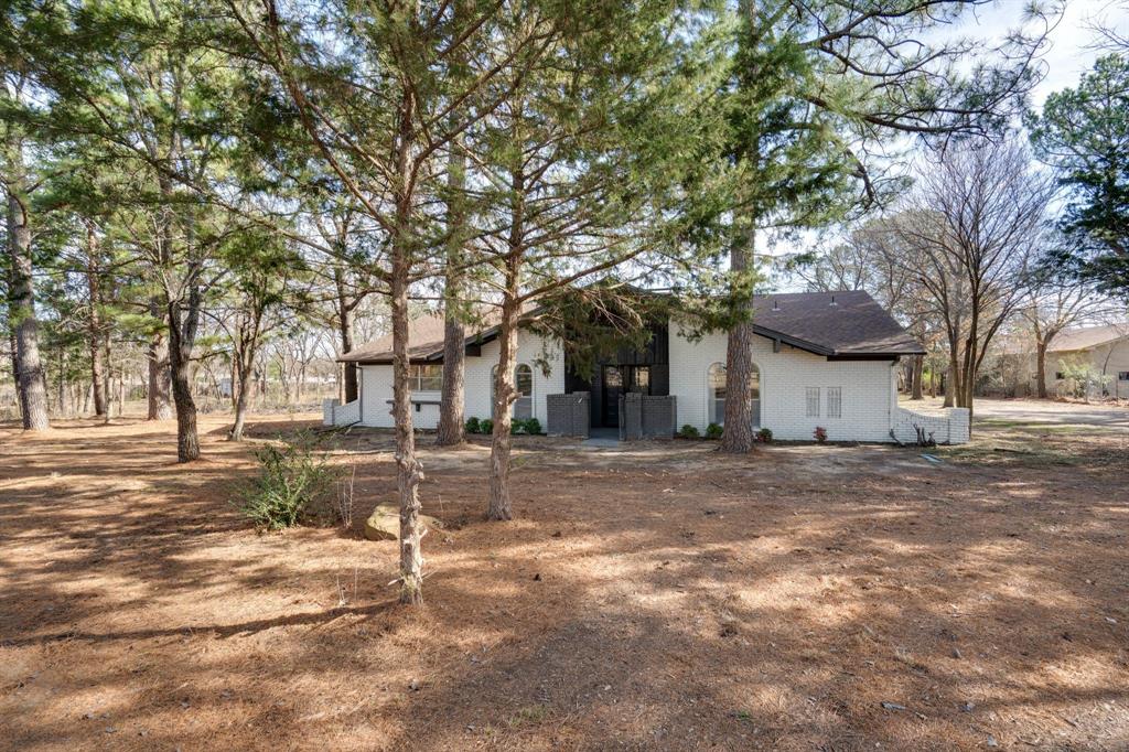890 Copper Canyon Road Copper Canyon, TX 76226 - Photo 7 of 37 a view of a house with a yard
