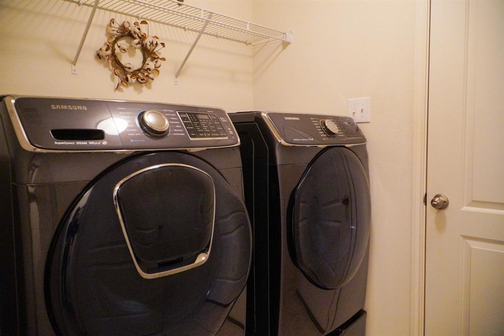 13624 Helix Bridge Way Crowley, TX 76036 - Photo 13 of 25 a utility room with dryer and washer