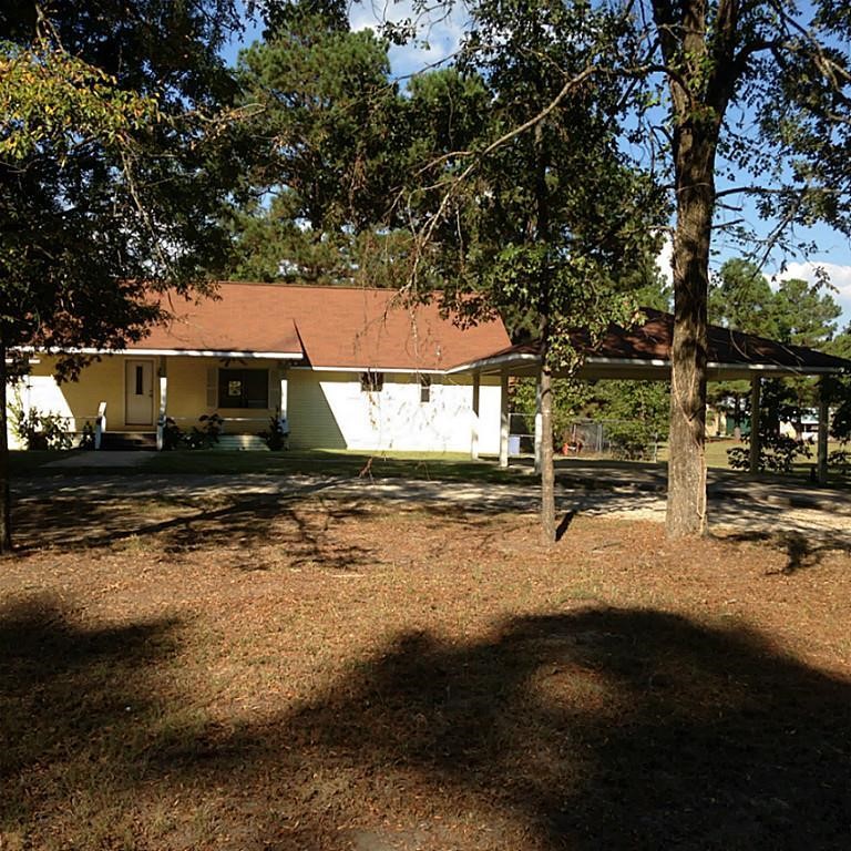 420 Mangum Road Livingston, TX 77351 - Photo 4 of 36 Mature Trees line a circle drive with two carports