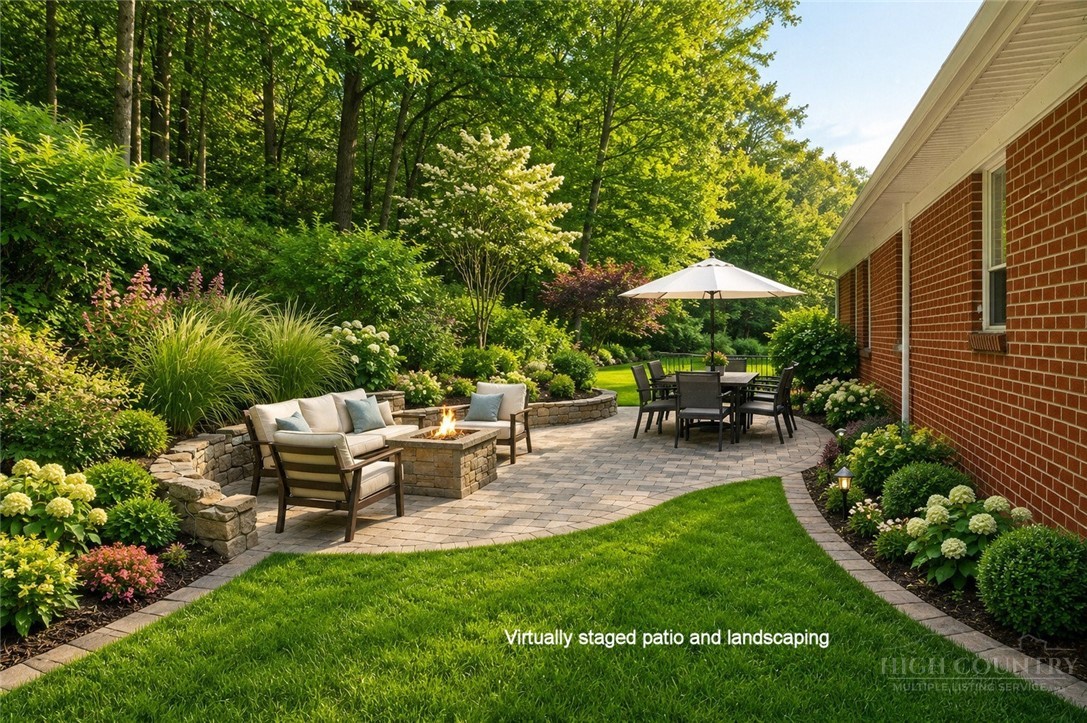 2510 Rich Hill Road Creston, NC 28615 - Photo 37 of 38 a view of backyard with seating space and green space
