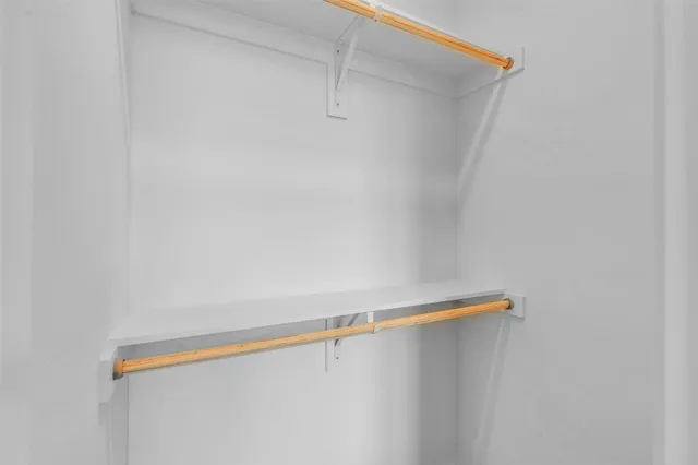 a bathroom with a sink mirror vanity and toilet