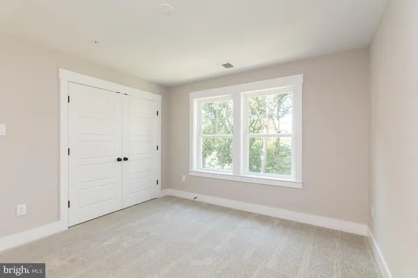 a bathroom with a sink toilet a mirror and shower