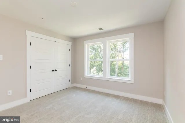 a bathroom with a sink toilet a mirror and shower