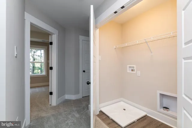 a view of kitchen and wooden floor