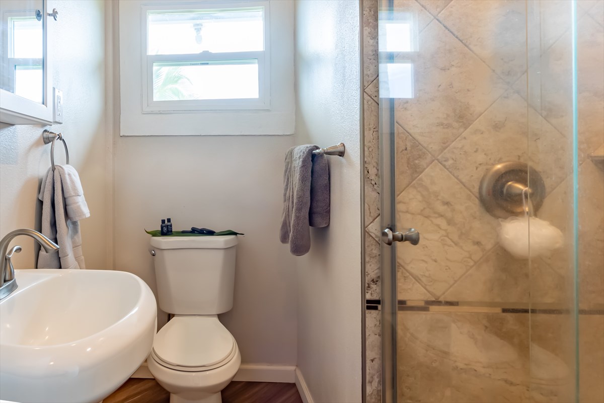 4517 Kala Road Kekaha, HI 96752 - Photo 7 of 19 a white toilet sitting next to a bathroom sink