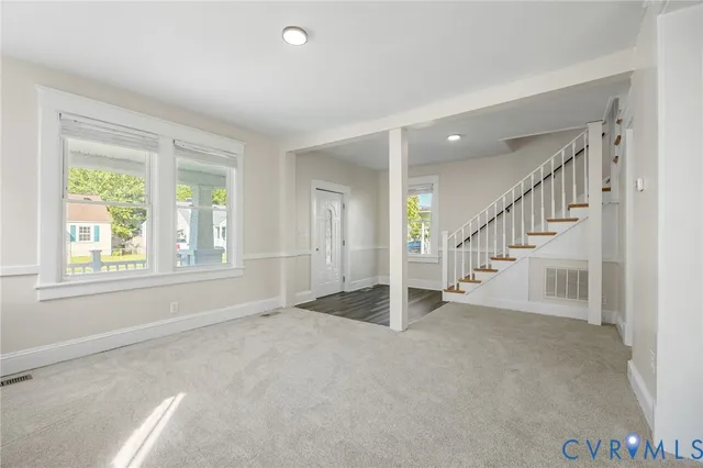 a view of an empty room with a window