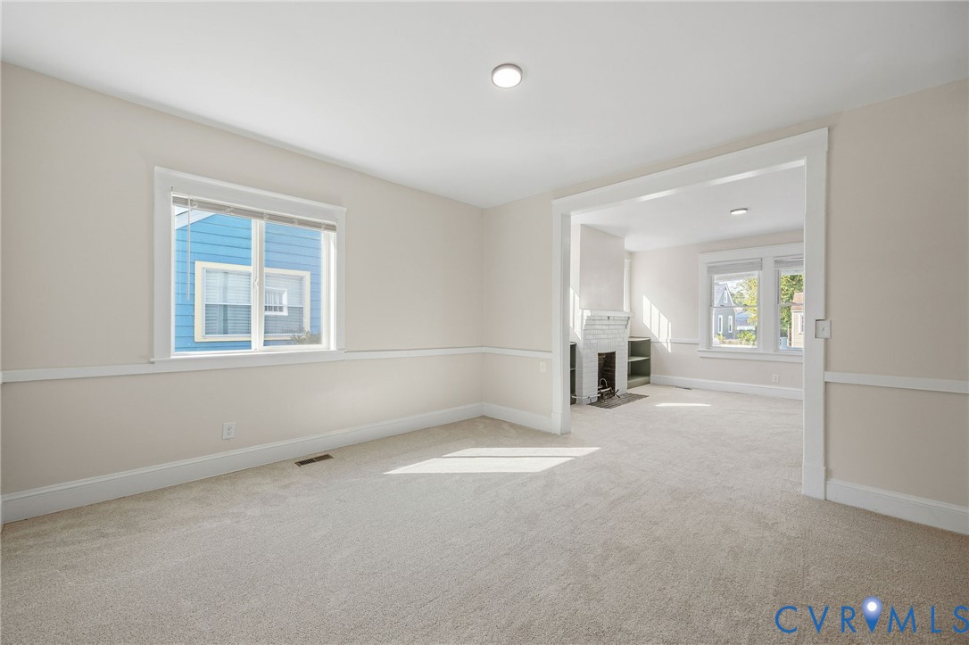 623 Colonial Avenue Colonial Heights, VA 23834 - Photo 17 of 44 an empty room with windows and fireplace