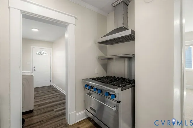 a kitchen with granite countertop white cabinets and sink