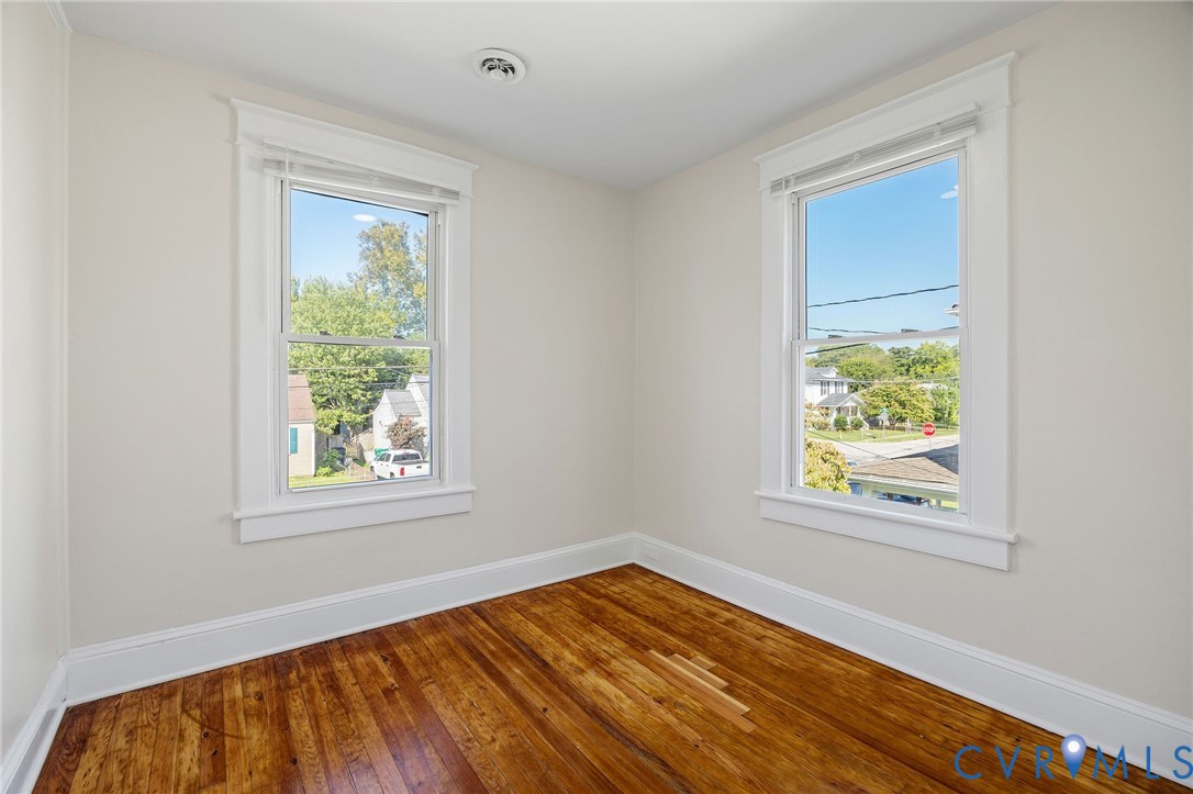 623 Colonial Avenue Colonial Heights, VA 23834 - Photo 36 of 44 a view of an empty room with wooden floor and a window