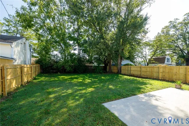 a backyard of a house with lots of green space