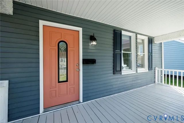 a view of front door deck and living room