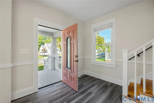a view of entryway with wooden floor