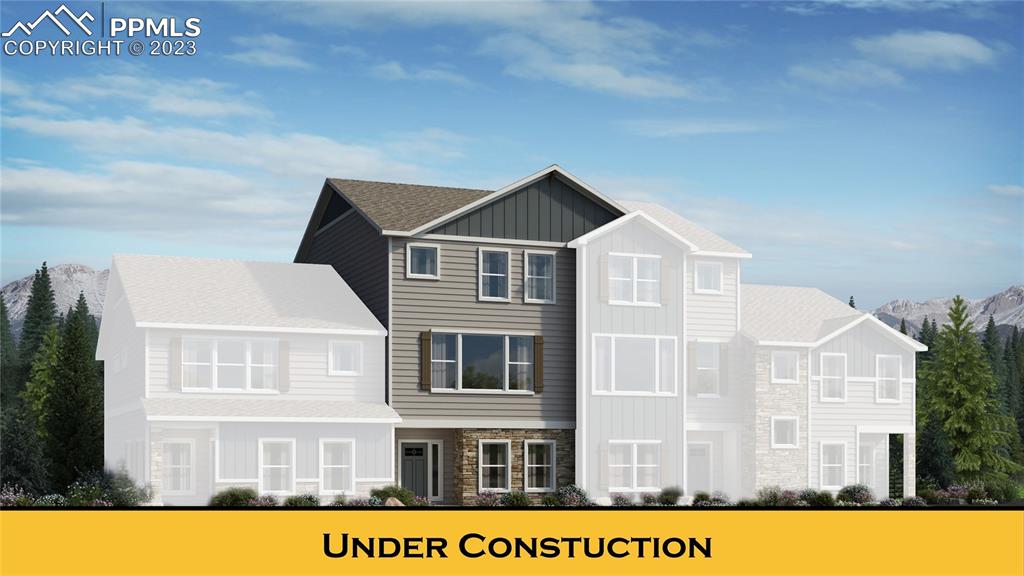 6069 Inman View Colorado Springs, CO 80924 - Photo 1 of 13 a front view of a house with a yard