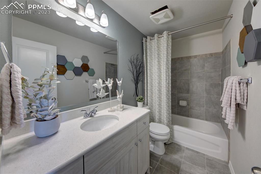 6069 Inman View Colorado Springs, CO 80924 - Photo 12 of 13 a bathroom with a sink a toilet and shower