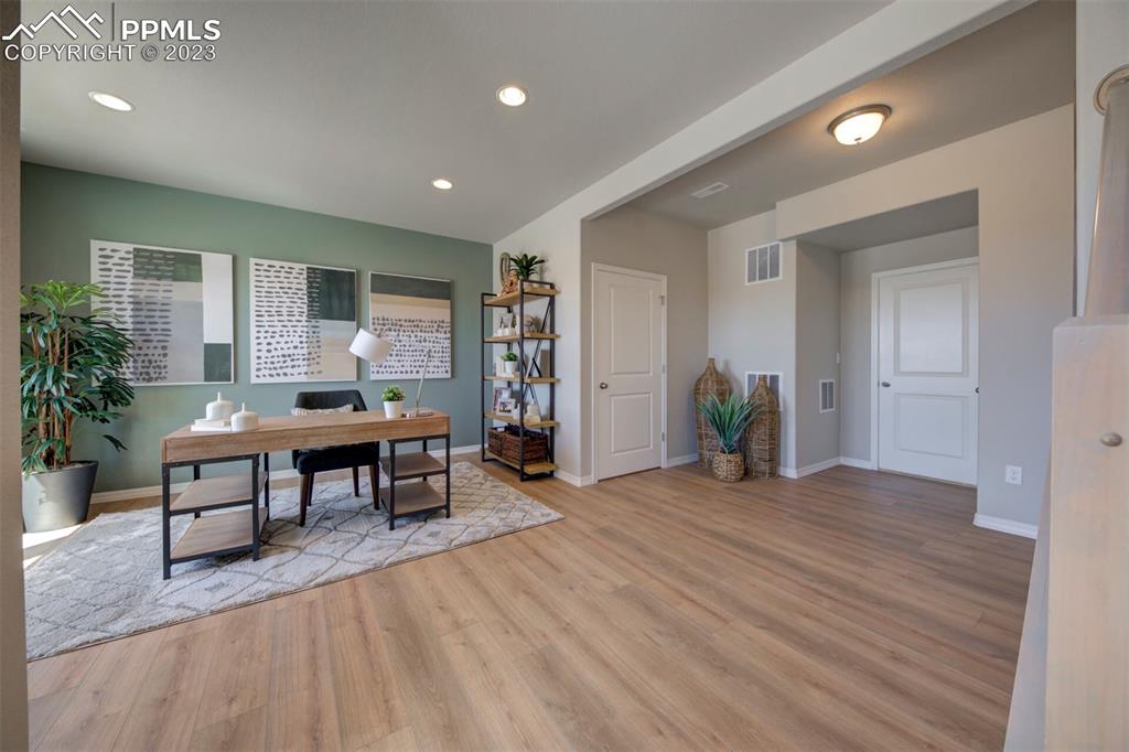 6069 Inman View Colorado Springs, CO 80924 - Photo 5 of 13 a living room with furniture and a table