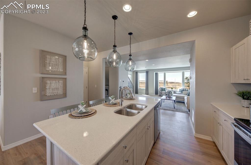 6069 Inman View Colorado Springs, CO 80924 - Photo 7 of 13 a very nice looking dining room with wooden floor